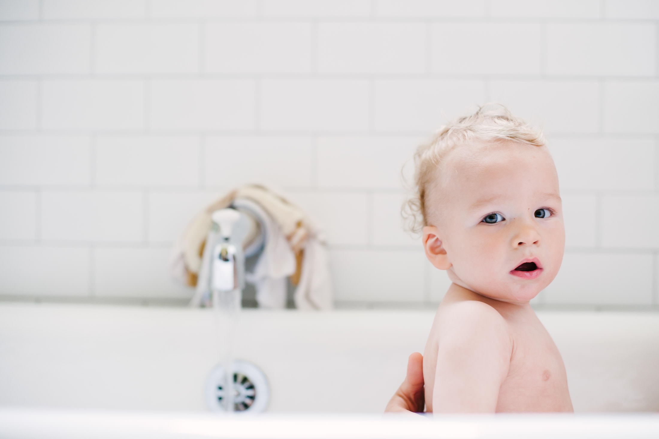 Oakland Baby in kitchen sink