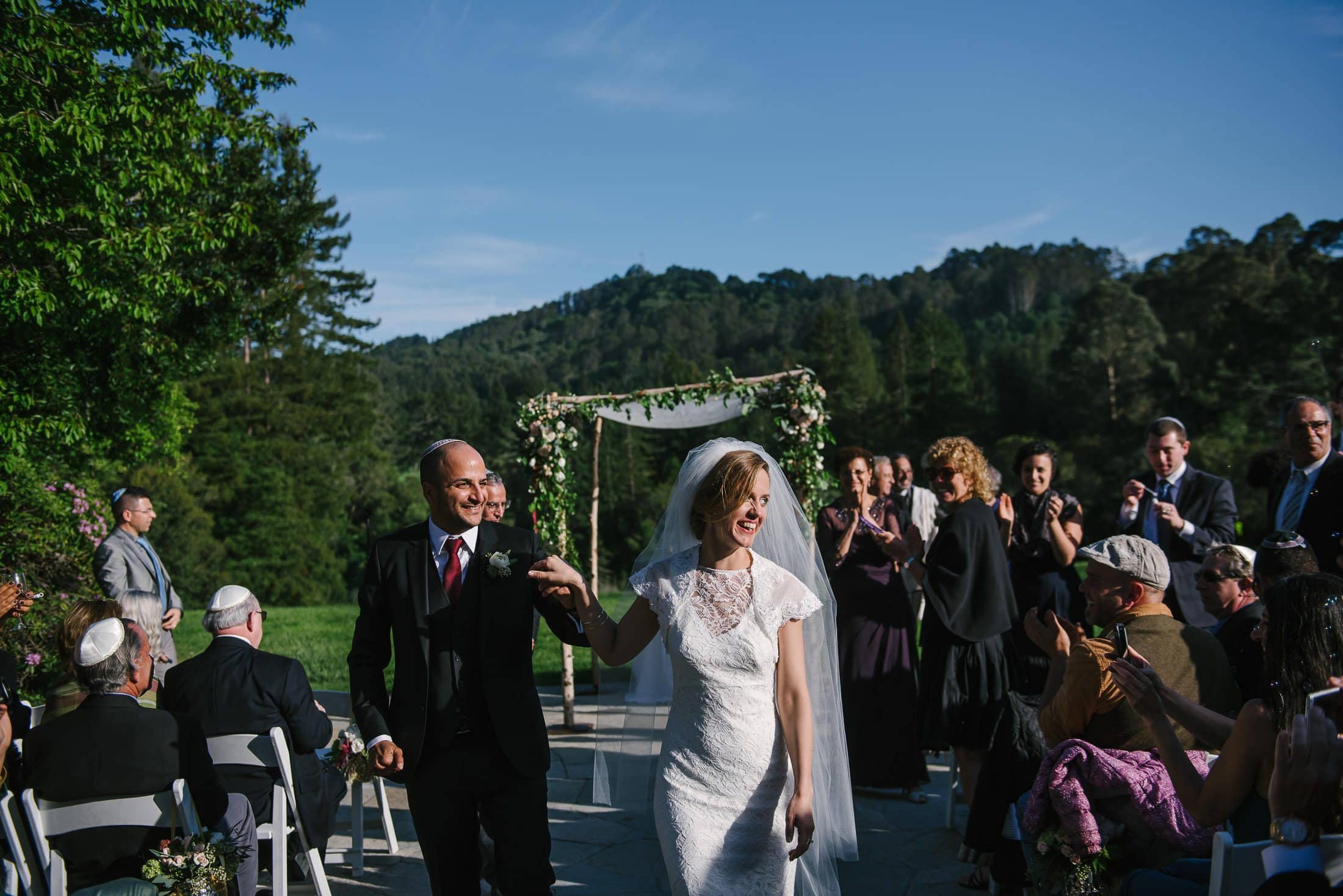 Couple walking down isle at the Brazilian Room. Part of a mash up of 5 Brazil Room Weddings