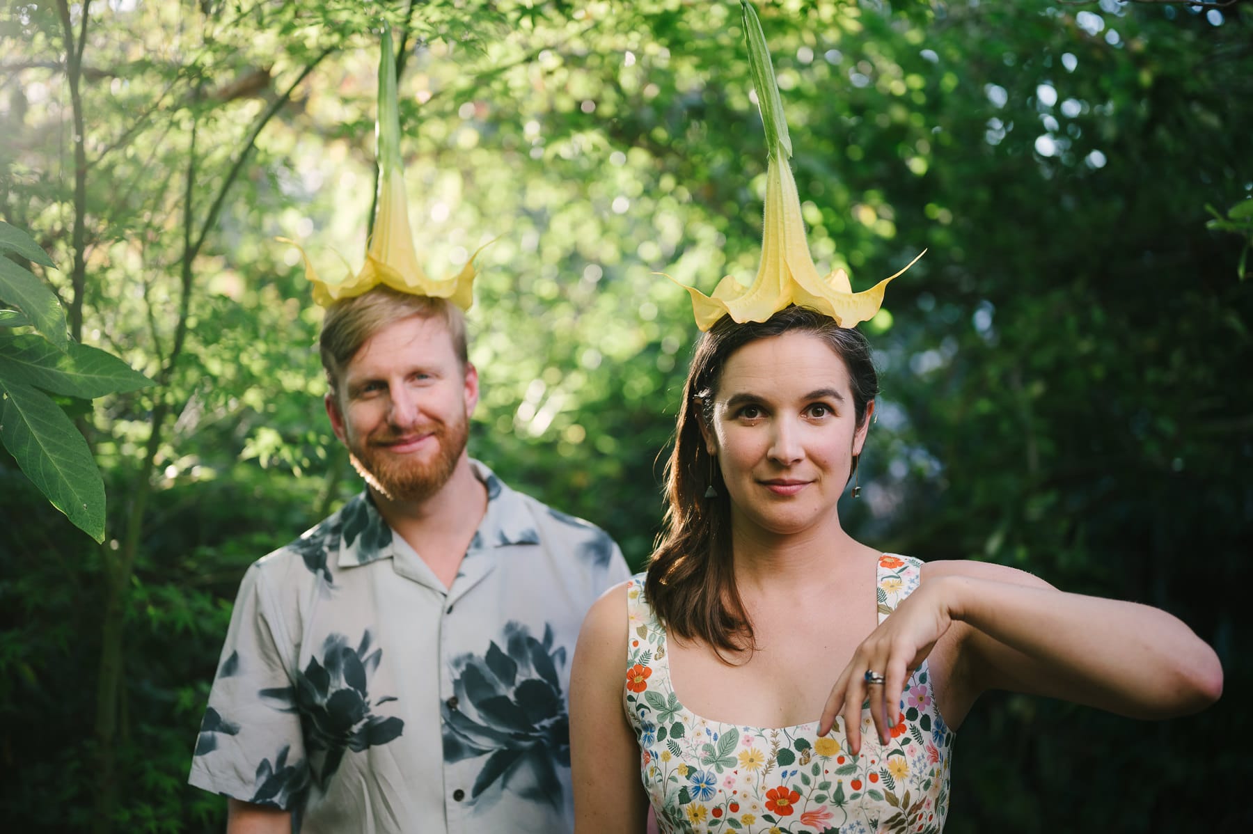 Couple wearing floral prints with yellow flowers on their heads at engagement session in San Francisco.