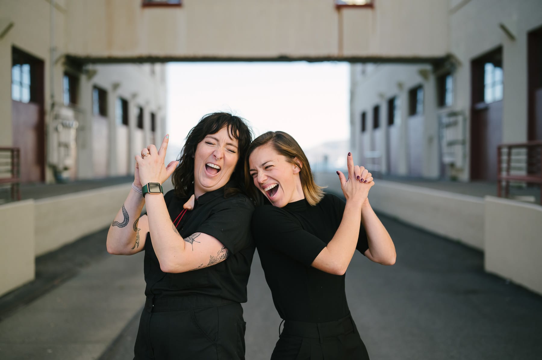 Event planner, Willa Via, and her planning assistant, Jennifer Hassen striking a goofy pose at a wedding in Fort Mason.