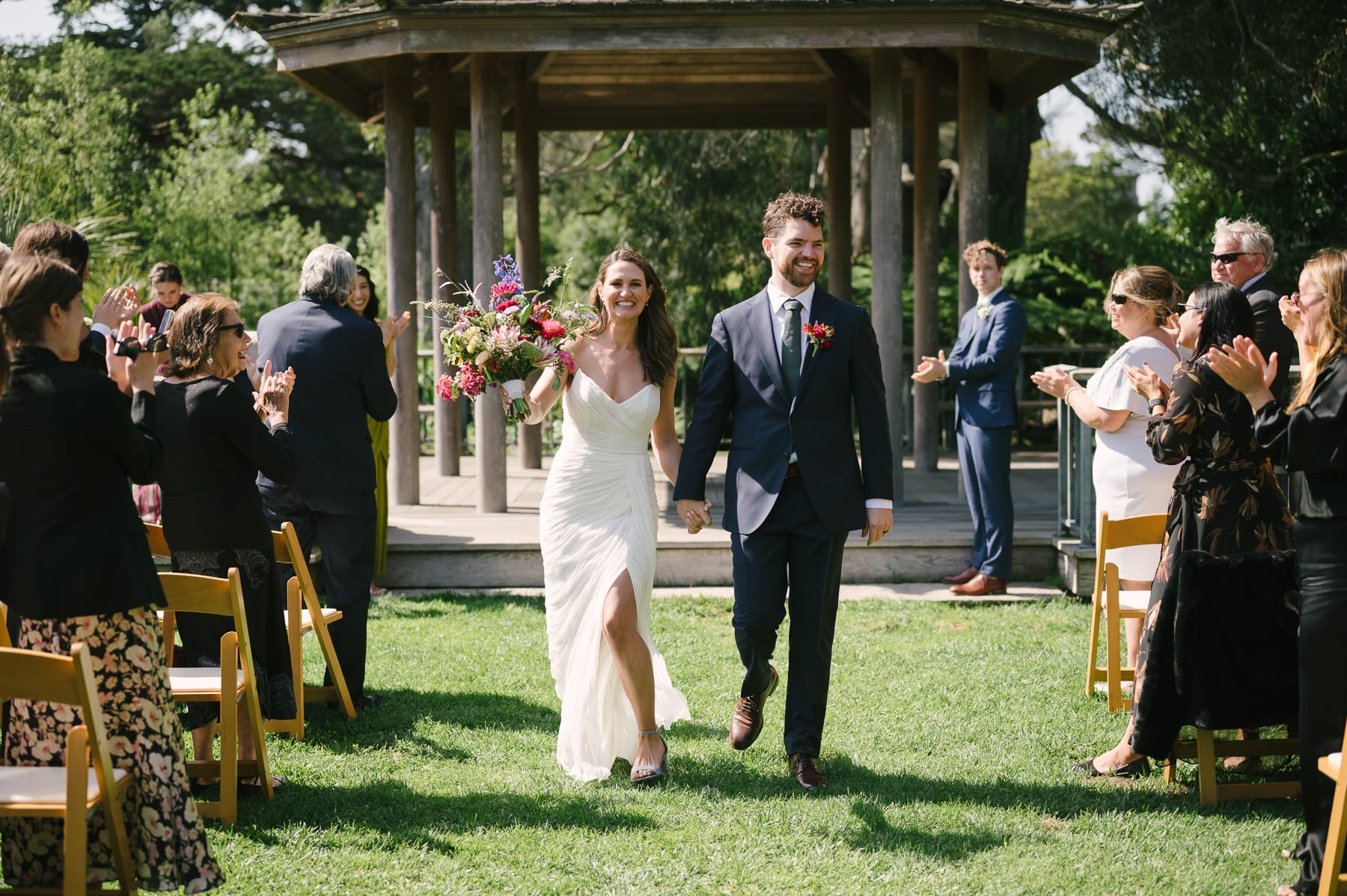 Bride and Groom celebrating after ceremony in Golden Gate Park Botanical Garden.