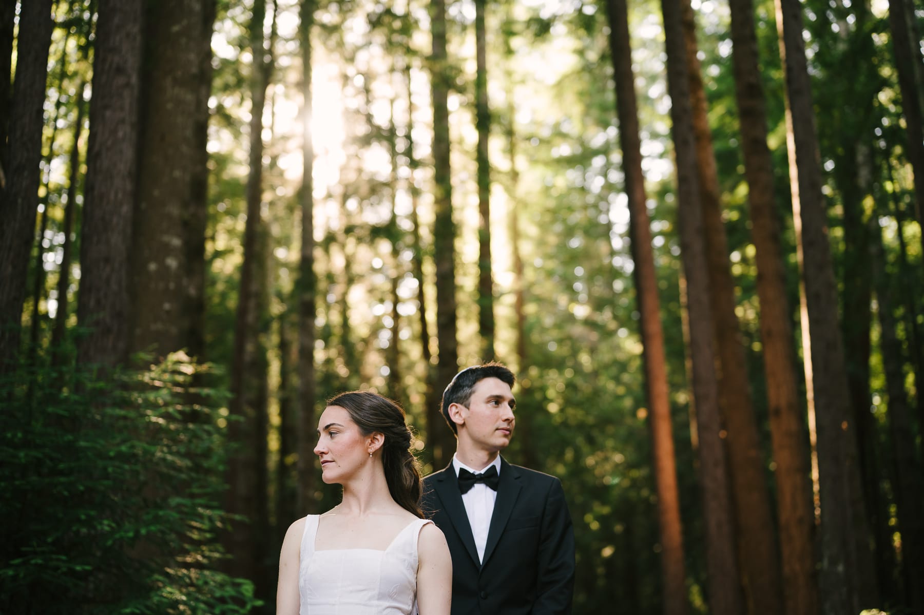 Couple posing for portrait at Heartwood Mendocino wedding.