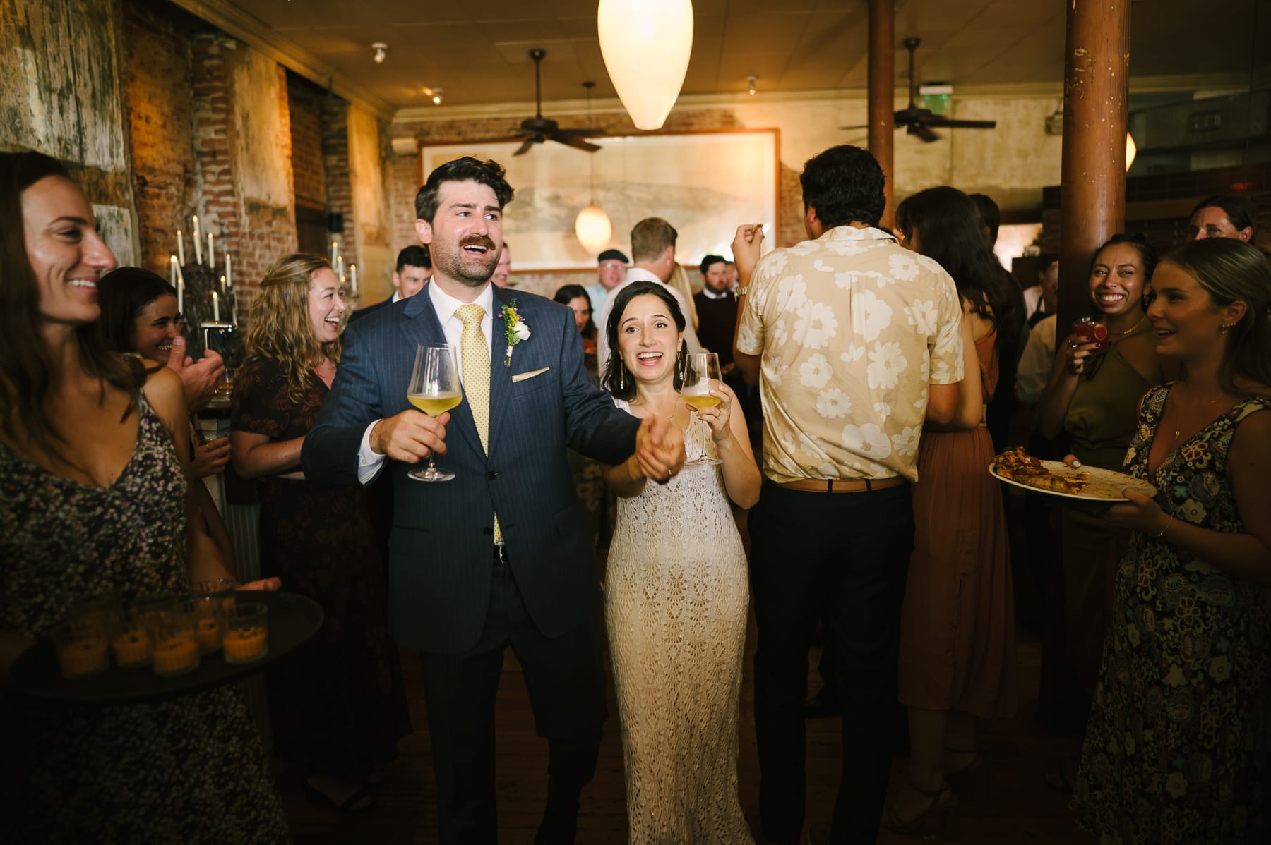 Couple arriving to cocktail hour at Pizzaiolo wedding